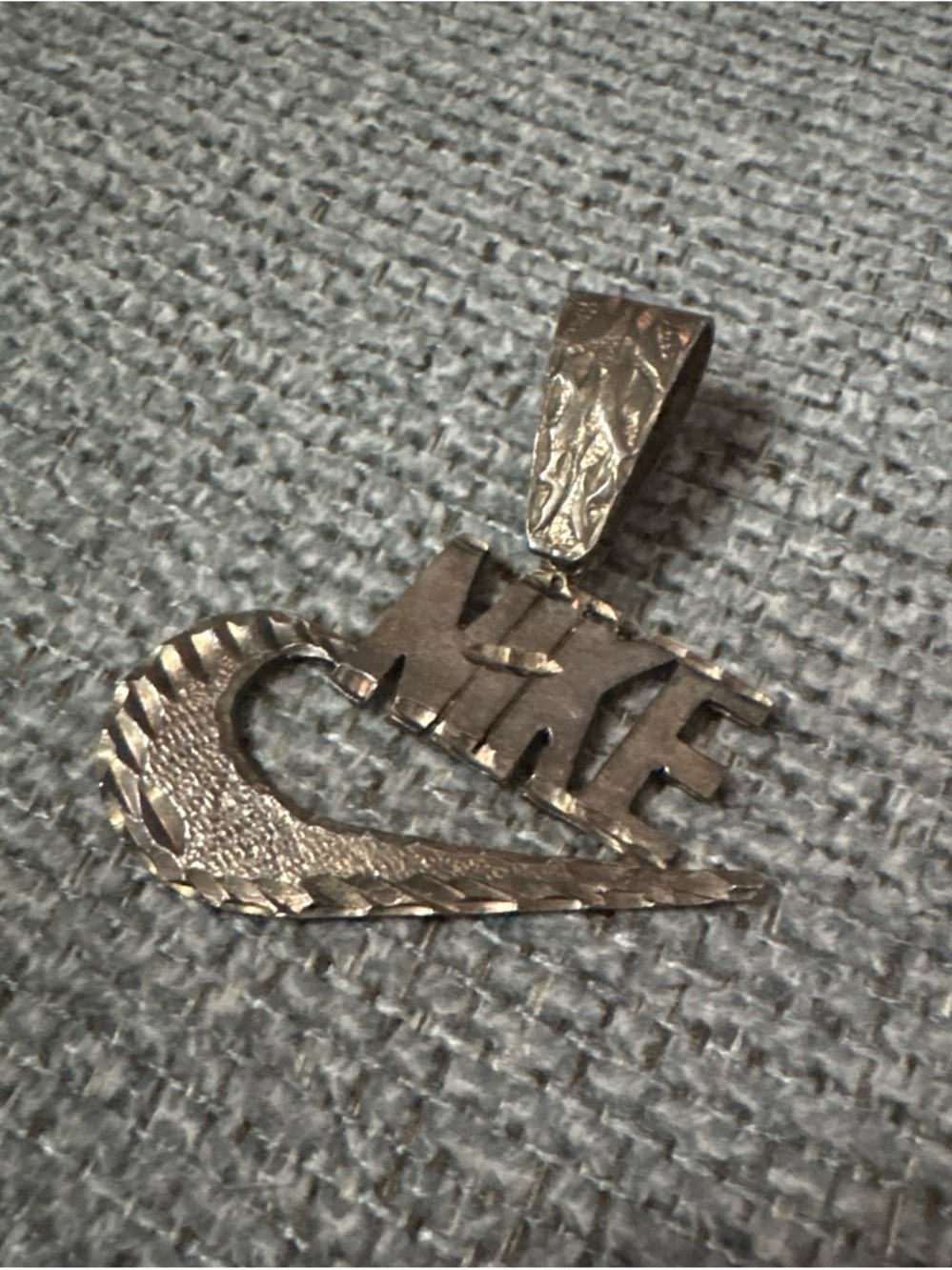 Nike Silver-Tone Textured Swoosh Pendant